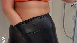 hot babe in sports bra and leggings teases and masturbates in the shower