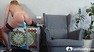 curly-haired beauty enjoys a homemade session