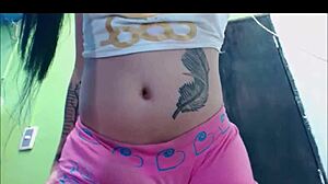 Transsexual babe in pink undies pleasures herself on webcam