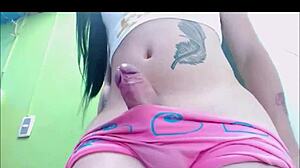 Transsexual babe in pink undies pleasures herself on webcam