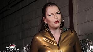 Slave kneels before strict German MILF latex mistress Lady Julina in nylons.