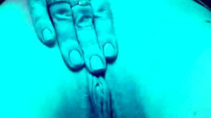 Blonde slut fingers wet pussy in club toilet