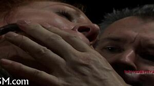 in this intense sadomasochism scene, a dominant figure controls the submissive partner through hardcore acts of pain and pleasure