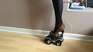 Toy car crushed under high heels