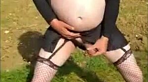 Bisexual crossdresser masturbates cock outdoors and cums