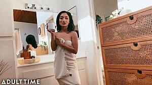 i relax in the shower as an asian beauty bathes nearby