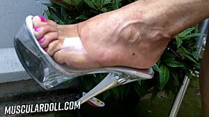 Hey, check out this big muscular milf strutting in high heels, looking so sexy and strong! 💪👠