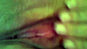 Wife achieves powerful squirt orgasm through solo masturbation