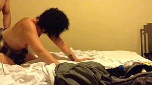 A woman in a mini skirt at a motel.