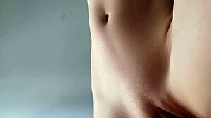 petite teen fingers herself solo with shaved pussy