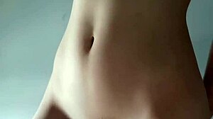 petite teen fingers herself solo with shaved pussy