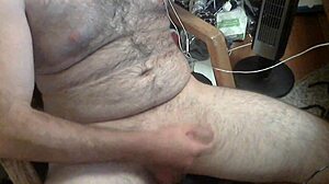 The solo handjob session unfolds in quiet focus