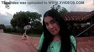 I'm watching this sexy colombian puta lick a lollipop while showing off her body.