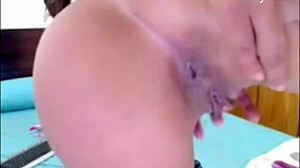 The stunning skinny beauty SPITS and FINGERS herself passionately.