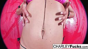 Charley, the brunette pornstar, oils her big tits and ass before masturbating her pussy solo.