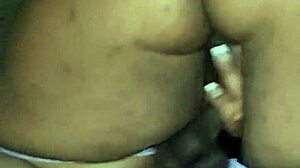 Hot Ebony Wears Purple Buttplug And Rides Big Black Rubber Cock