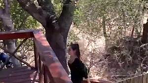 blonde and african friends share outdoor shower in south africa