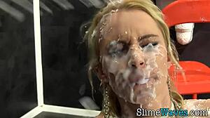Wow, watch this slut take a messy bukkake facial at the gloryhole!
