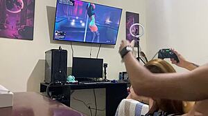 Hey, she's sucking him off while he games on his console! 😏
