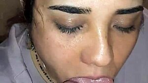 Watch me suck while he stares at my anal video.