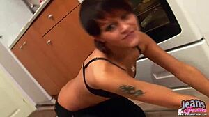 A petite blonde babe struggles with her tight skinny jeans