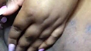 ebony beauty fingers herself to intense squirting orgasm