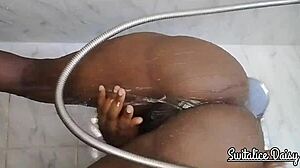 switalice daisy is recorded in the shower, playing with her trimmed pussy while bathing