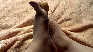 she gives a slow footjob in this homemade fetish video.