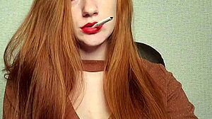 Redhead smoking a cigarette in the park