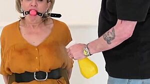 busty british housewife lady sonia is bound to a chair, gagged and choking in bdsm fetish