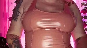 Curvy milf with huge tits and ass teases intensely in latex dress. Showing off natural assets