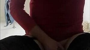 linda, the colombian ladyboy in red dress, enjoys a private moment