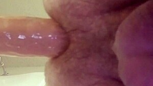 gay tries to fit large dildo in ass, pushing hard and moaning loudly!