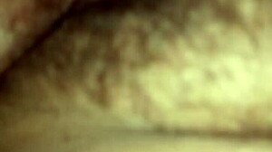 A mature woman with a wet pussy in close-up