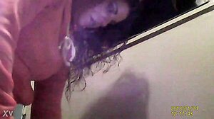 a lady uses the bathroom while being spied on