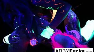 Abigal Mac and Ava Addams share oral and anal lesbian sex under black lights