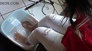 Foot massage for Barefoot Asian in soapy feet