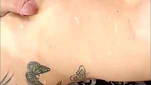 this teen shemale is stroking her big tits and cumming hard