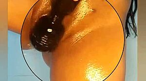 Teen in oil shower fucking with dildo and squirt