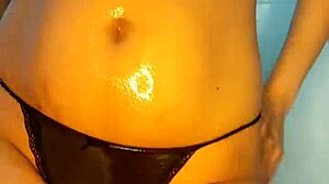 Teen in oil shower fucking with dildo and squirt