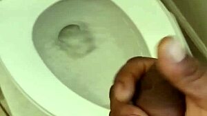 Black guy strokes his cock in solo masturbation