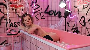 Anita relaxes in pink trash bath with lingerie backstage webcam setup