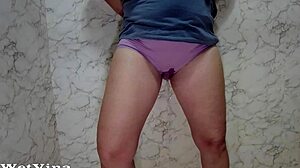 Mature woman bathes in shower.