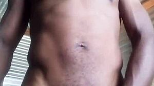 Horny amateur kneels to masturbate big black cock with huge balls