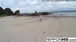 Asian babe sucks cock on sandy beach shore