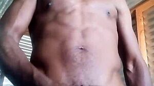 Horny amateur kneels to masturbate big black cock with huge balls