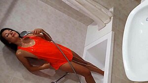 Watch her tease her wet pussy in the gym shower after a workout!