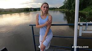 Ersties blonde babe pleasures herself outdoors with a vibrator.