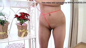 Shaved teen masturbates with rope in tight pussy