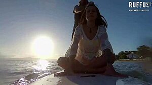 i'm relaxing on the beach with my friend, enjoying the paddle